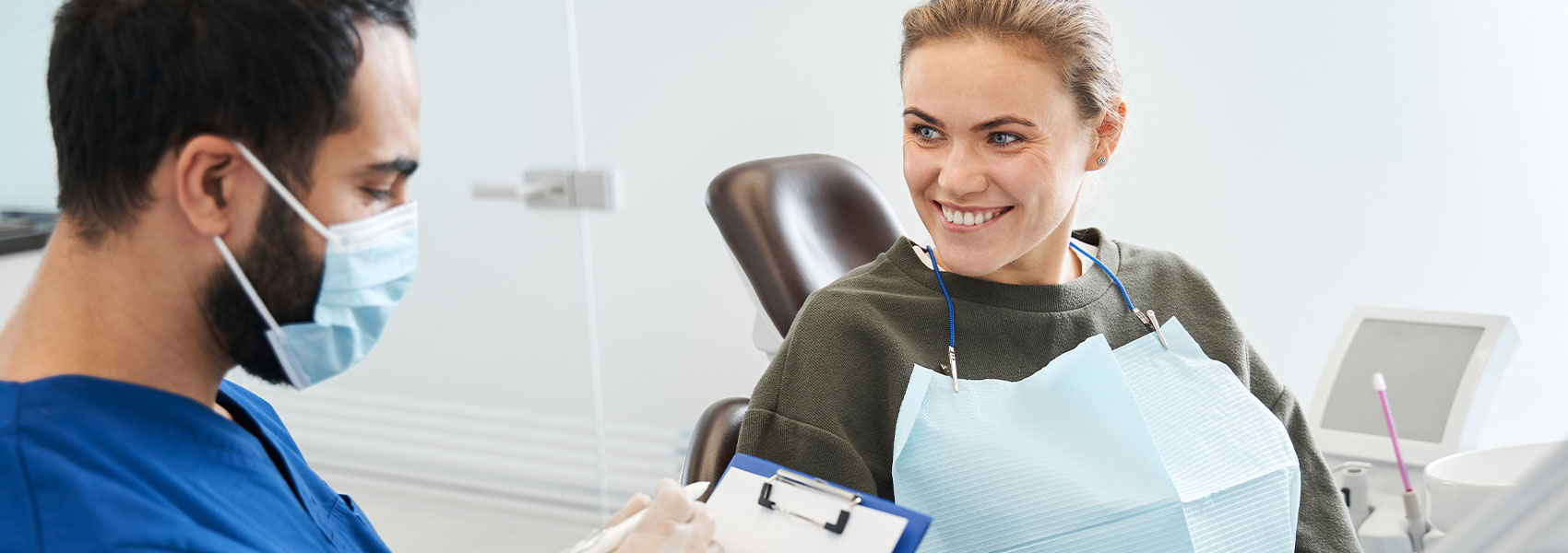 Beautiful woman smiling with dentist