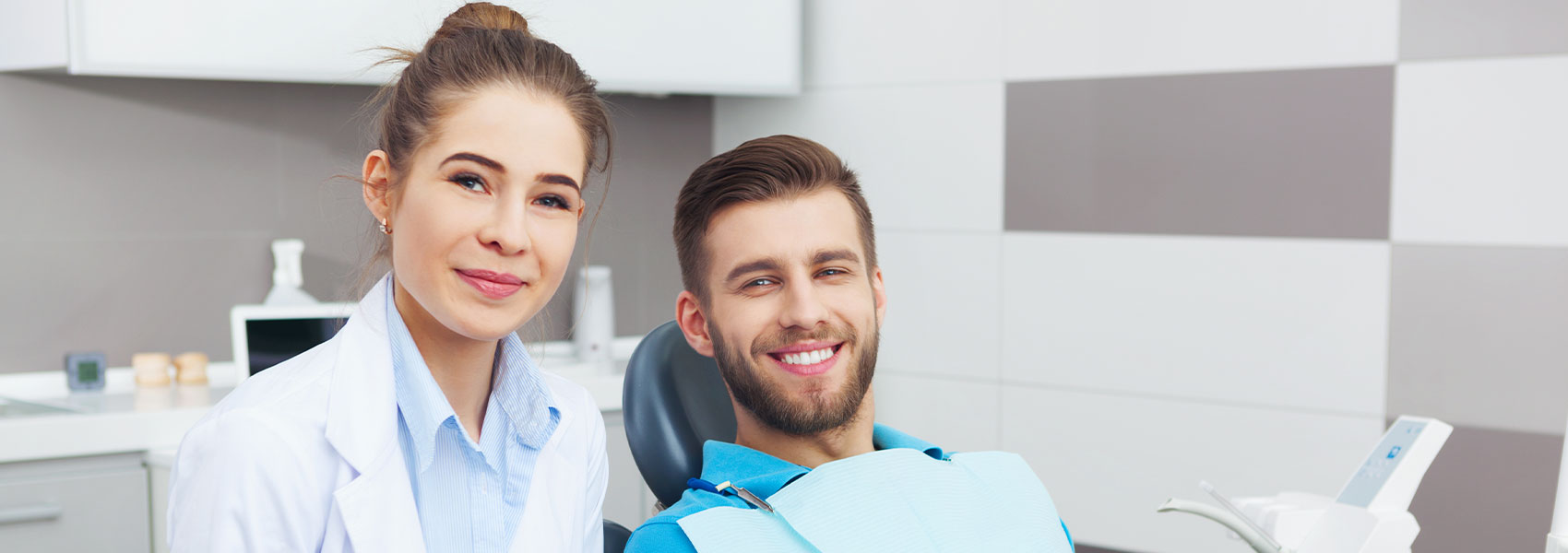 Dentist and patient smiling